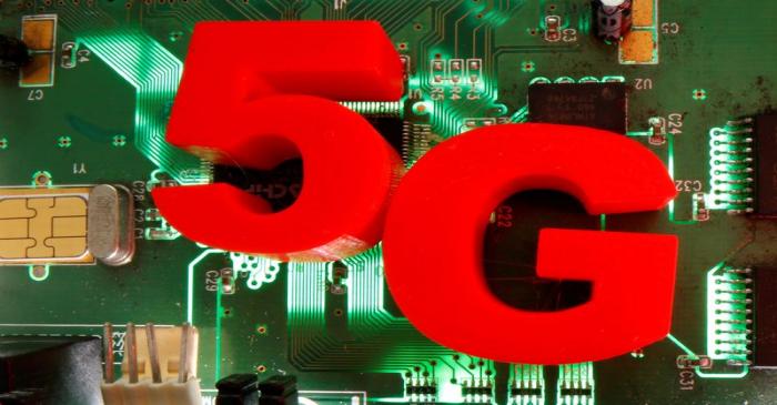 FILE PHOTO: 3D-printed objects representing 5G are put on a motherboard in this picture