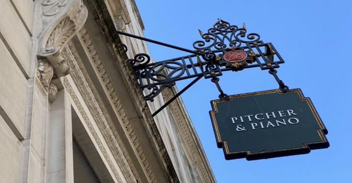 FILE PHOTO:  Signage for a Pitcher & Piano bar is seen in London