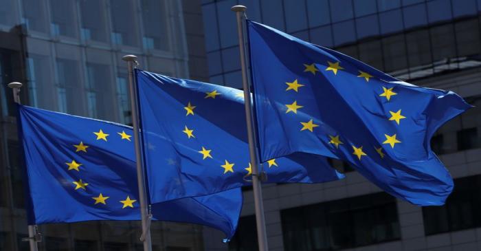 European Union flags flutter outside the European Commission headquarters in Brussels