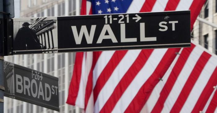 FILE PHOTO: The Wall Street sign is pictured at the New York Stock exchange (NYSE) in the