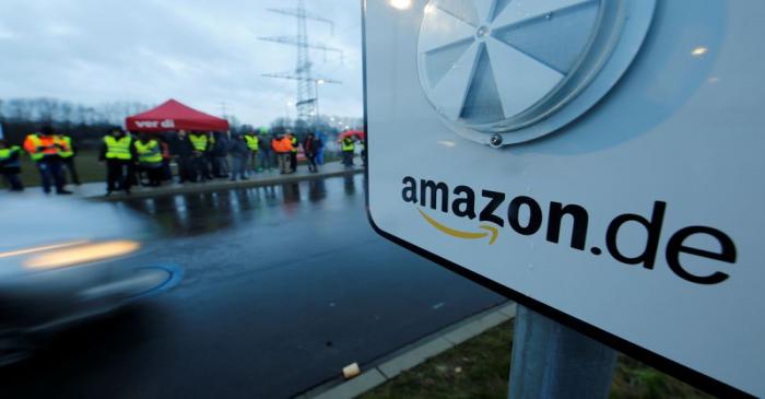 FILE PHOTO: Workers and Verdi union members protest during strike action at a Amazon logistics