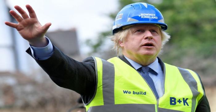 Britain's Prime Minister Boris Johnson visits the construction site of Ealing Fields High