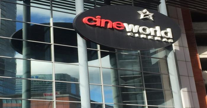 A Cineworld cinema logo is pictured in Canary Wharf in London