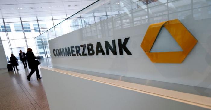 Visitors arrive at Commerzbank's headquarters before the bank's annual news conference in