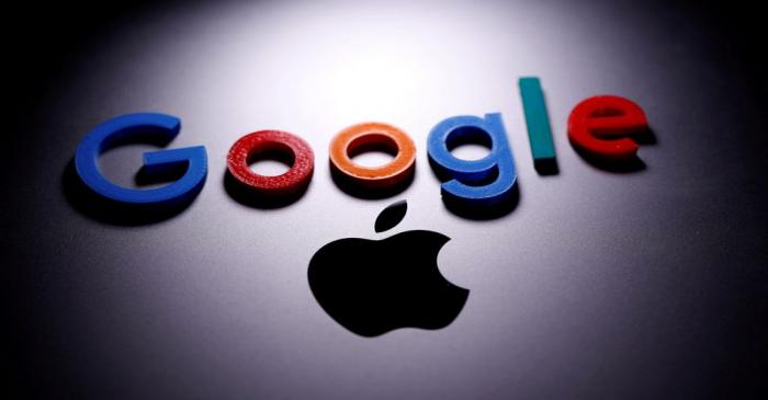 FILE PHOTO: A 3D printed Google logo is placed on the Apple Macbook in this illustration