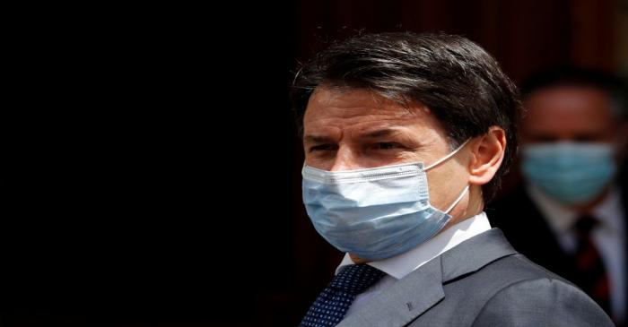 FILE PHOTO: Italian Prime Minister Giuseppe Conte wearing a protective face mask, leaves the