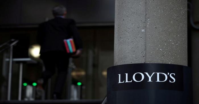 FILE PHOTO: Man enters the Lloyd's of London building in the City of London financial district