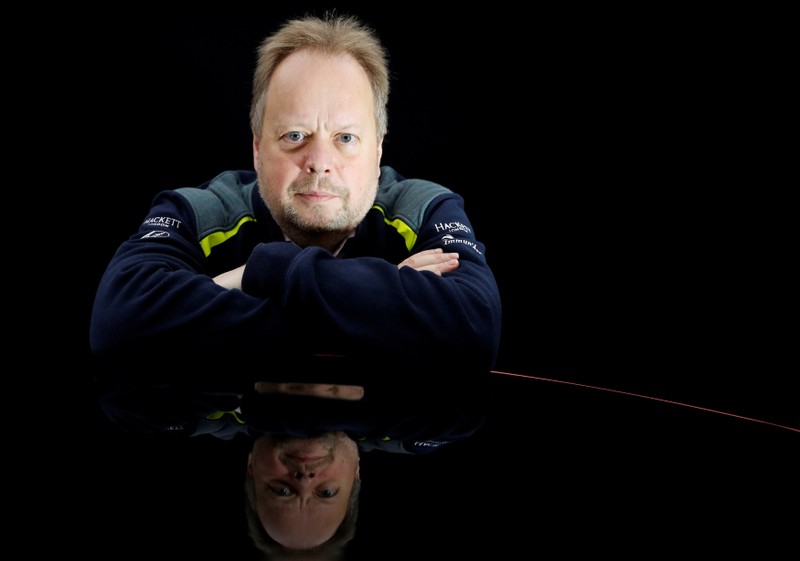 FILE PHOTO: Andy Palmer, CEO of Aston Martin, poses for a photograph next to the company's new