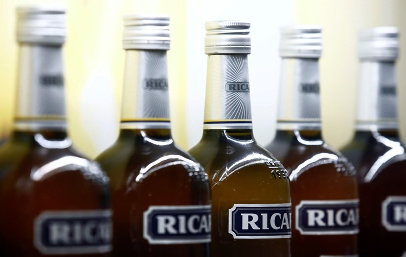 A logo is seen on a bottle of the Ricard aniseed-flavoured beverage displayed during French