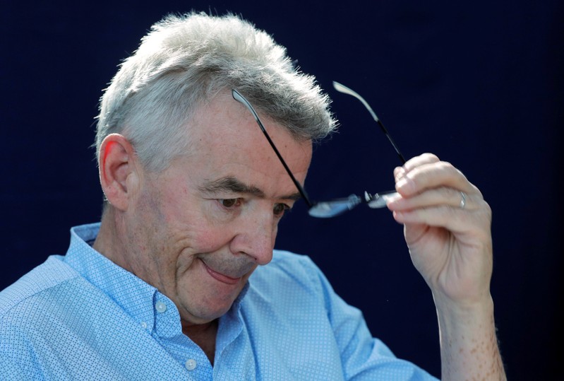 Ryanair Chief Executive O'Leary takes off his glasses during a news conference in Vienna