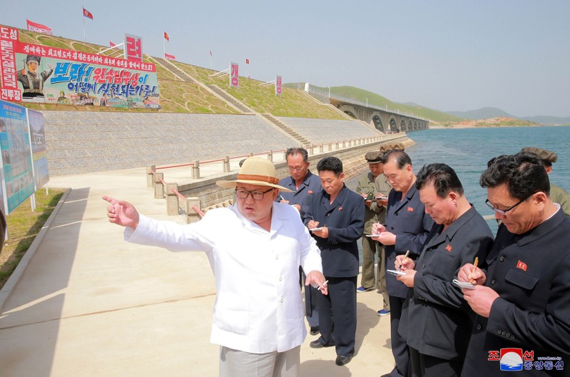 FILE PHOTO: North Korean leader Kim Jong Un inspects the completed railway that connects Koam