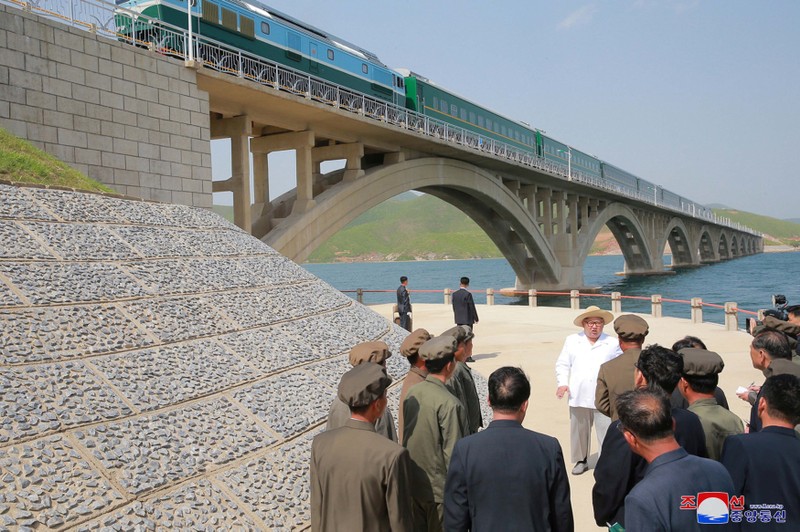 FILE PHOTO: North Korean leader Kim Jong Un inspects the completed railway that connects Koam