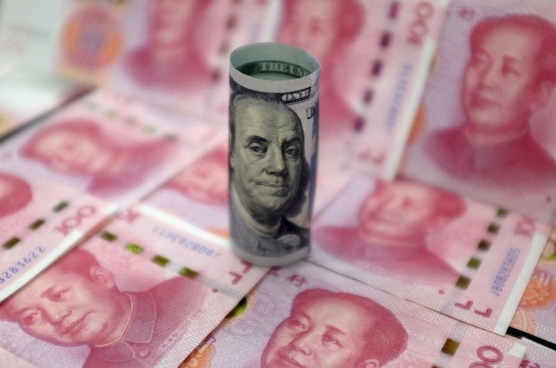 Benjamin Franklin U.S. 100-dollar banknote and Chinese 100-yuan banknotes depicting the late