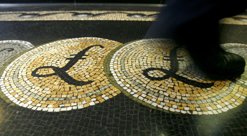 FILE PHOTO: Pound sterling symbols on the floor of the front hall of the Bank of England