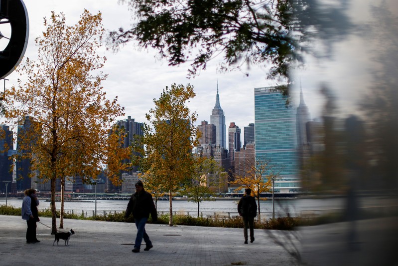 People walk along Gantry Plaza State Park, in Long Island City, where Amazon.com is reportedly
