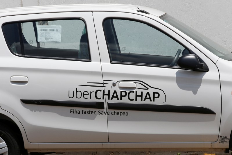 A Suzuki car branded with Uber stickers is seen in a showroom in Nairobi