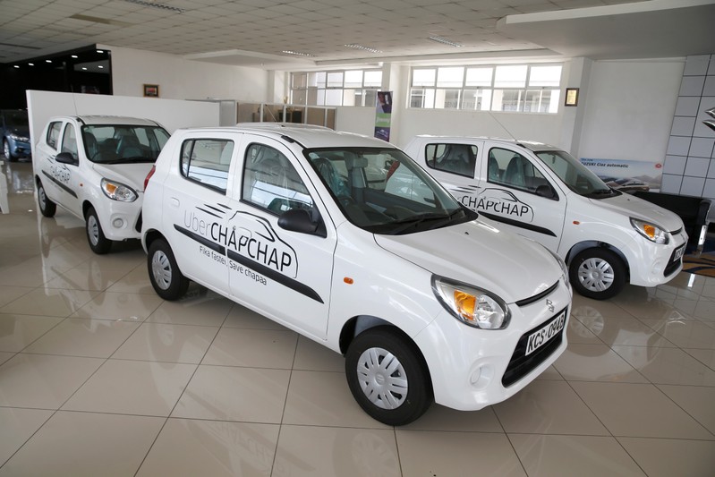 Suzuki cars branded with Uber stickers are seen in a showroom in Nairobi
