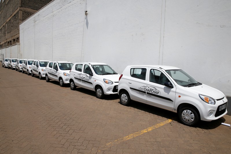 Suzuki cars branded with Uber stickers are seen in a showroom in Nairobi