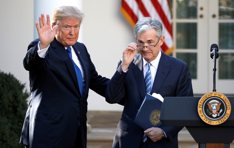 FILE PHOTO: U.S. President Donald Trump gestures with Jerome Powell, his nominee to become