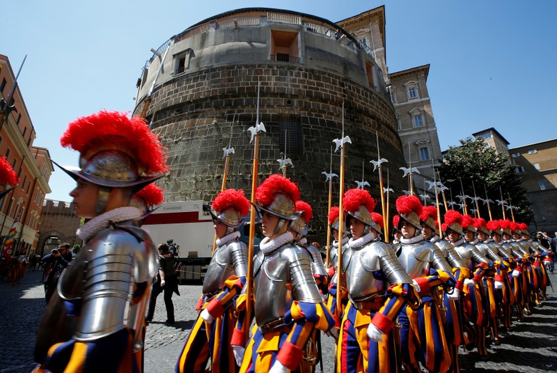 FILE PHOTO: New recruits of the Vatican's elite Swiss Guard march in front of the tower of the