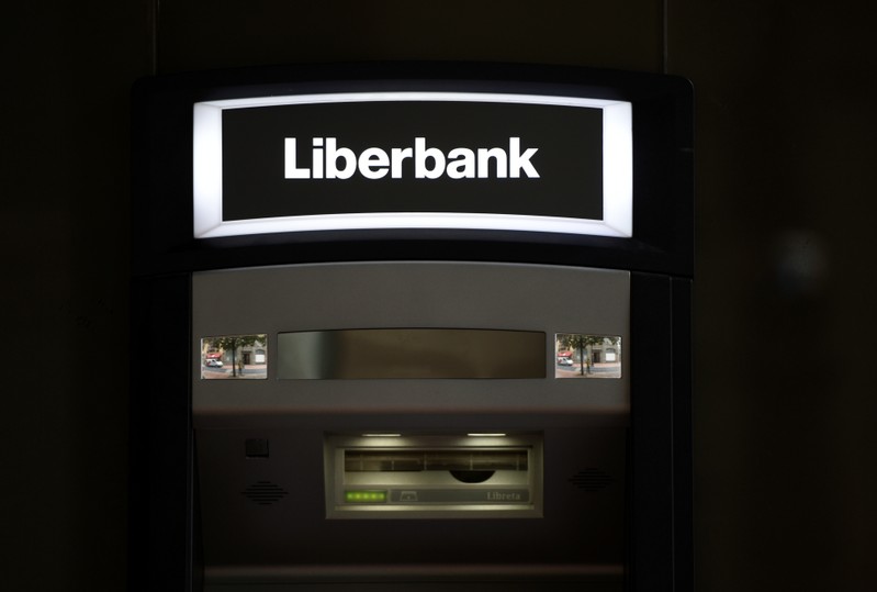 A cash dispenser is seen at a branch of Liberbank in Oviedo
