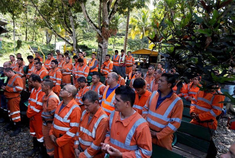 Miners gather for the morning greeting inside the facilities of the company Fura, in Coscuez