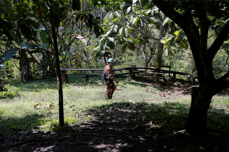 A miner walks through the lands of the company Fura in Coscuez