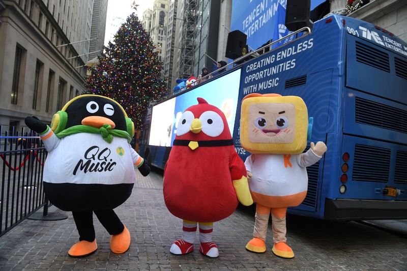 Mascots of Tencent Music Entertainment celebrate the company's IPO outside of the NYSE in New