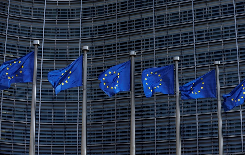 European Union flags flutter outside the EU Commission headquarters in Brussels