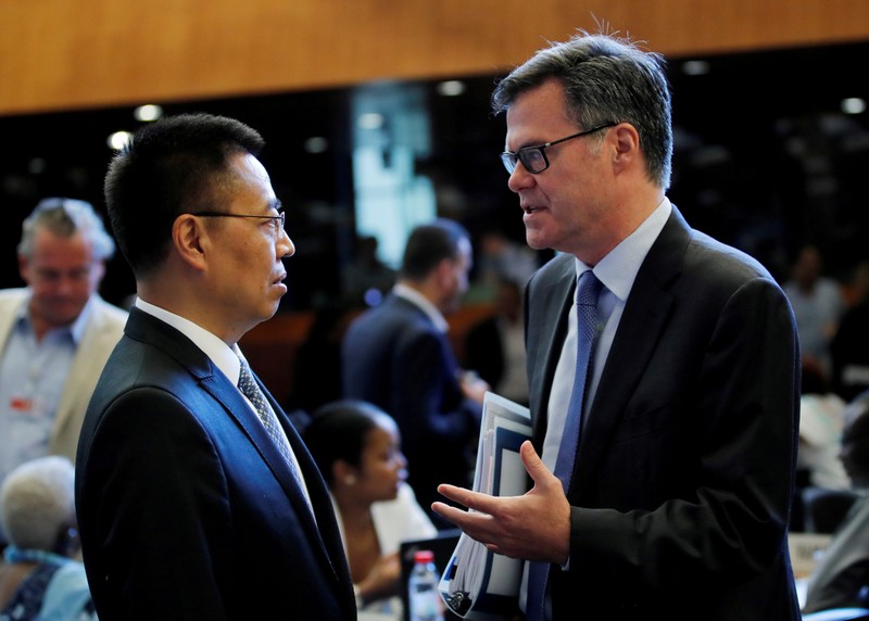FILE PHOTO: Shea U.S. Ambassador to the WTO talks with Zhang Chinese Ambassador to the WTO