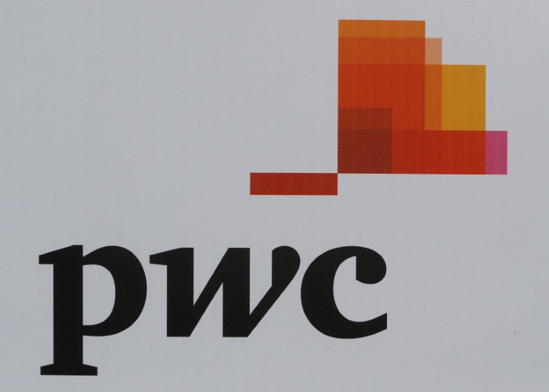FILE PHOTO: The logo of accounting firm PwC is seen on a board at the SPIEF 2017 in St.
