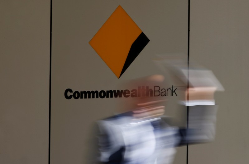 A man leaves the Commonwealth Bank of Australia building in central Sydney