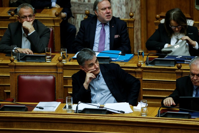 Greek Finance Minister Tsakalotos attends a parliamentary session before a budget vote in