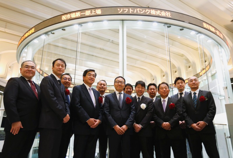 SoftBank Corp. President and CEO Ken Miyauchi poses for a photograph with the company