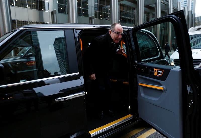 LEVC Chief Executive Chris Gubbey steps out of one of the company's electric cabs after an