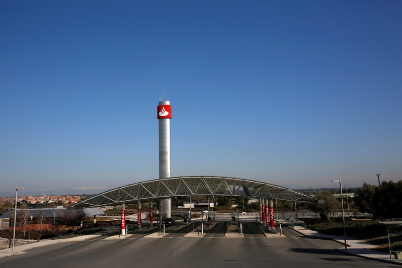 FILE PHOTO: The logo of Spain's biggest bank Santander is seen on top of a tower at the
