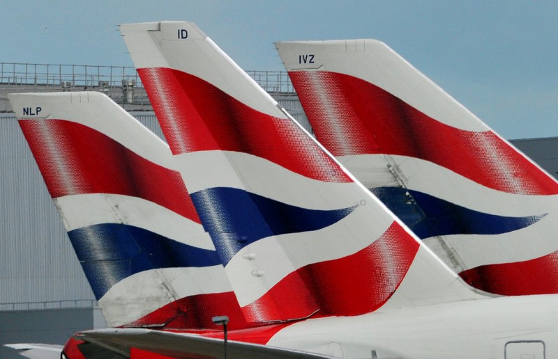 FILE PHOTO: British Airways logos are seen on tailfins at  Heathrow Airport in west London