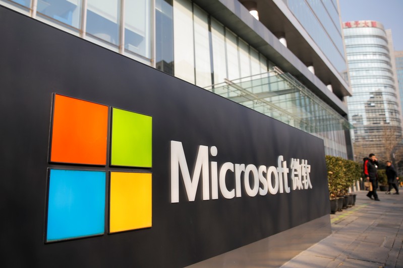 People walk outside the Microsoft office in Beijing