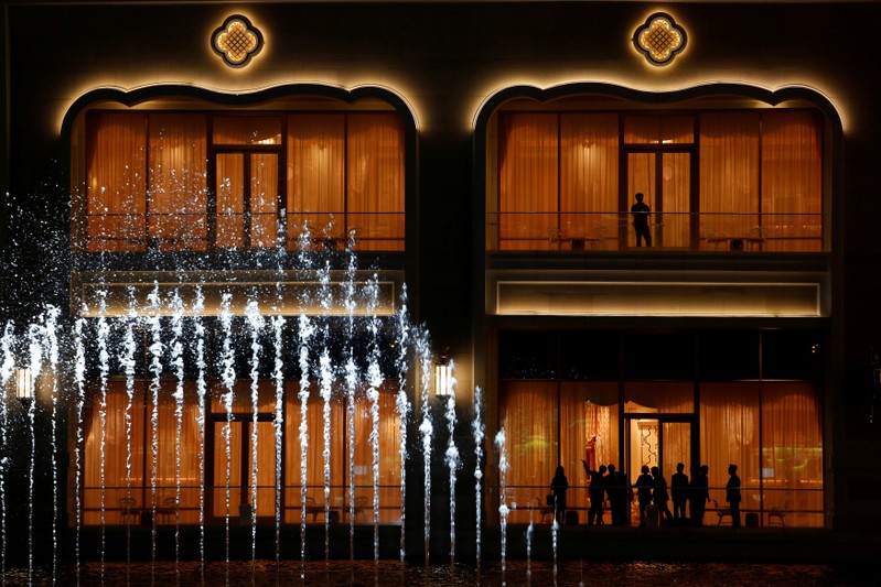 FILE PHOTO: People watch a water show at Wynn Palace during its opening in Macau