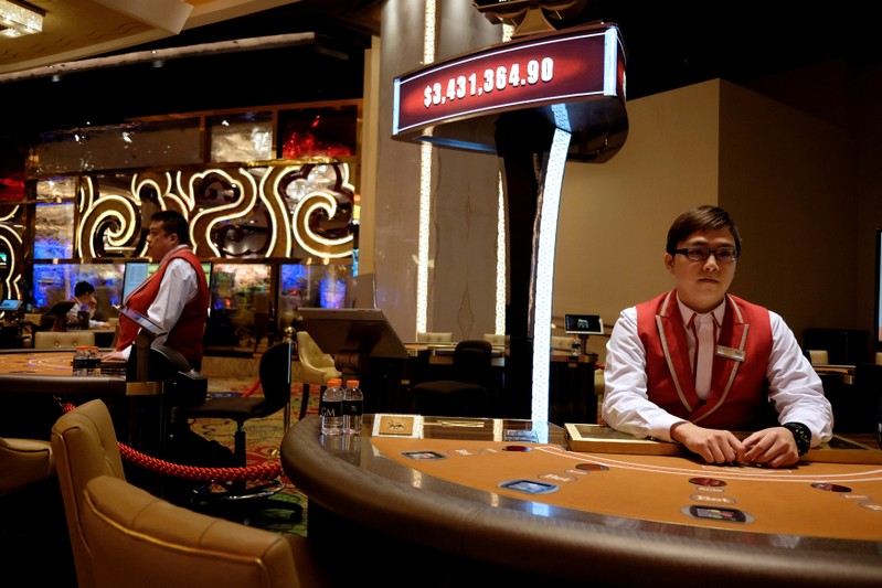 FILE PHOTO: Employees inside the casino prepare for the opening of MGM Cotai in Macau