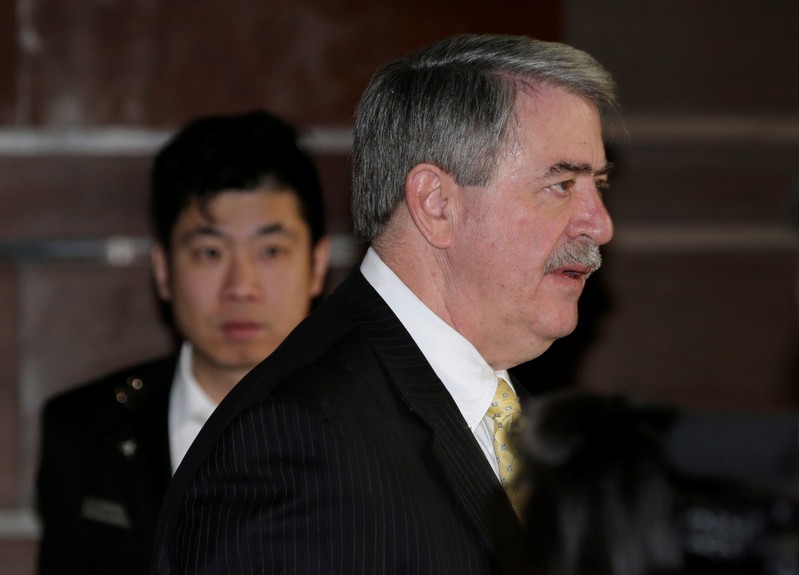 U.S. trade delegation member Ted McKinney leaves a hotel for talks with Chinese officials in
