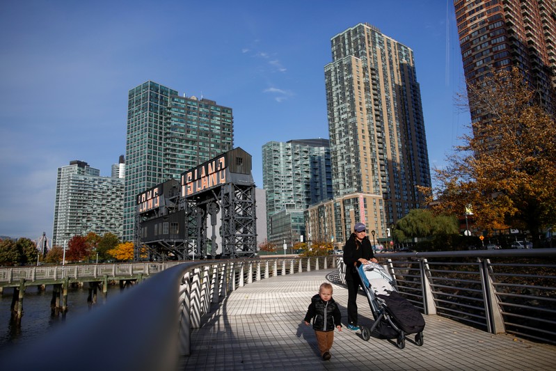 People walk along Gantry Plaza State Park, in Long Island City, where Amazon.com is reportedly
