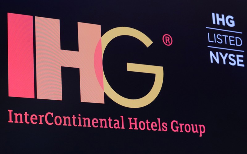 The ticker symbol and company logo for InterContinental Hotels Group is displayed on a screen
