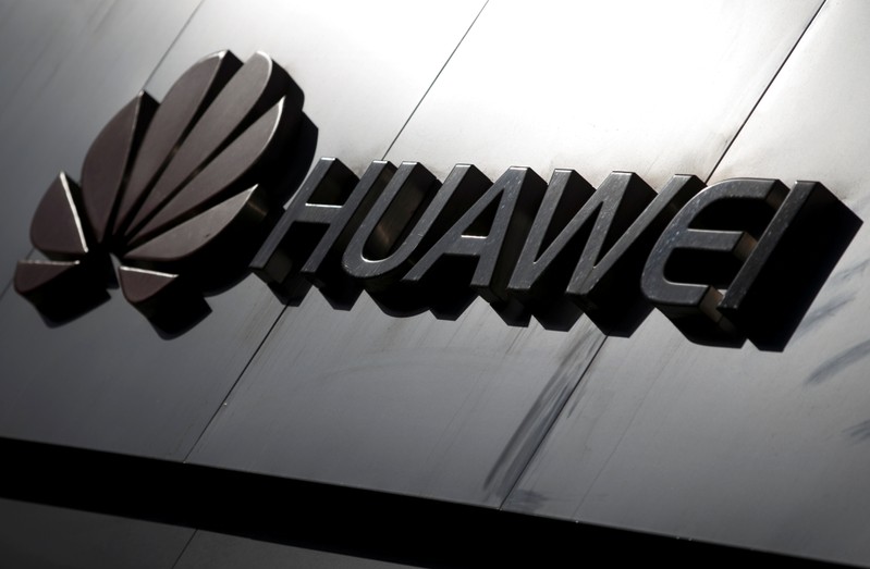 FILE PHOTO: The Huawei brand logo is seen above a store of the telecoms equipment maker in