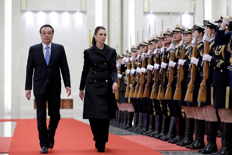 Jacinda Ardern and China's Premier Li Keqiang attend a welcome ceremony in Beijing