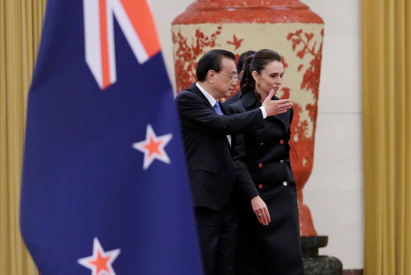 Jacinda Ardern and China's Premier Li Keqiang attend a welcome ceremony in Beijing