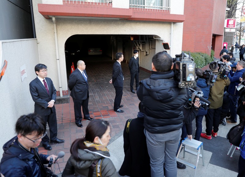 Journalists are seen in front of the residence of former Nissan Motor Chairman Carlos Ghosn in