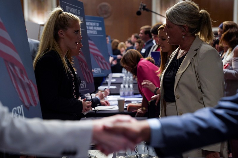 FILE PHOTO: People attend the Executive Branch Job Fair hosted by the Conservative Partnership