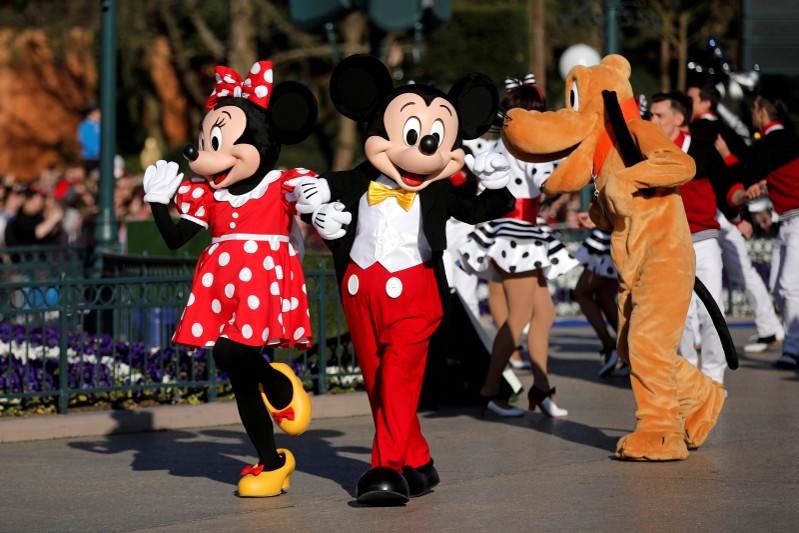 FILE PHOTO: Disney characters Mickey Mouse and Minnie Mouse attend the 25th anniversary of