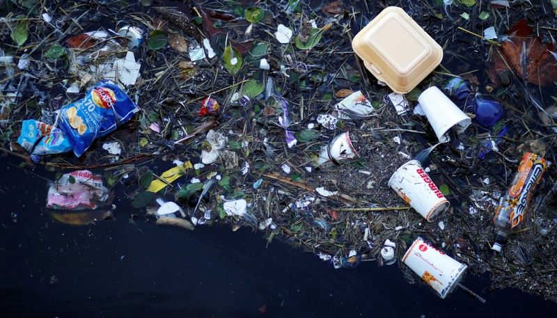 FILE PHOTO: Plastic and other waste is seen floating on the Marine Lake at New Brighton beach